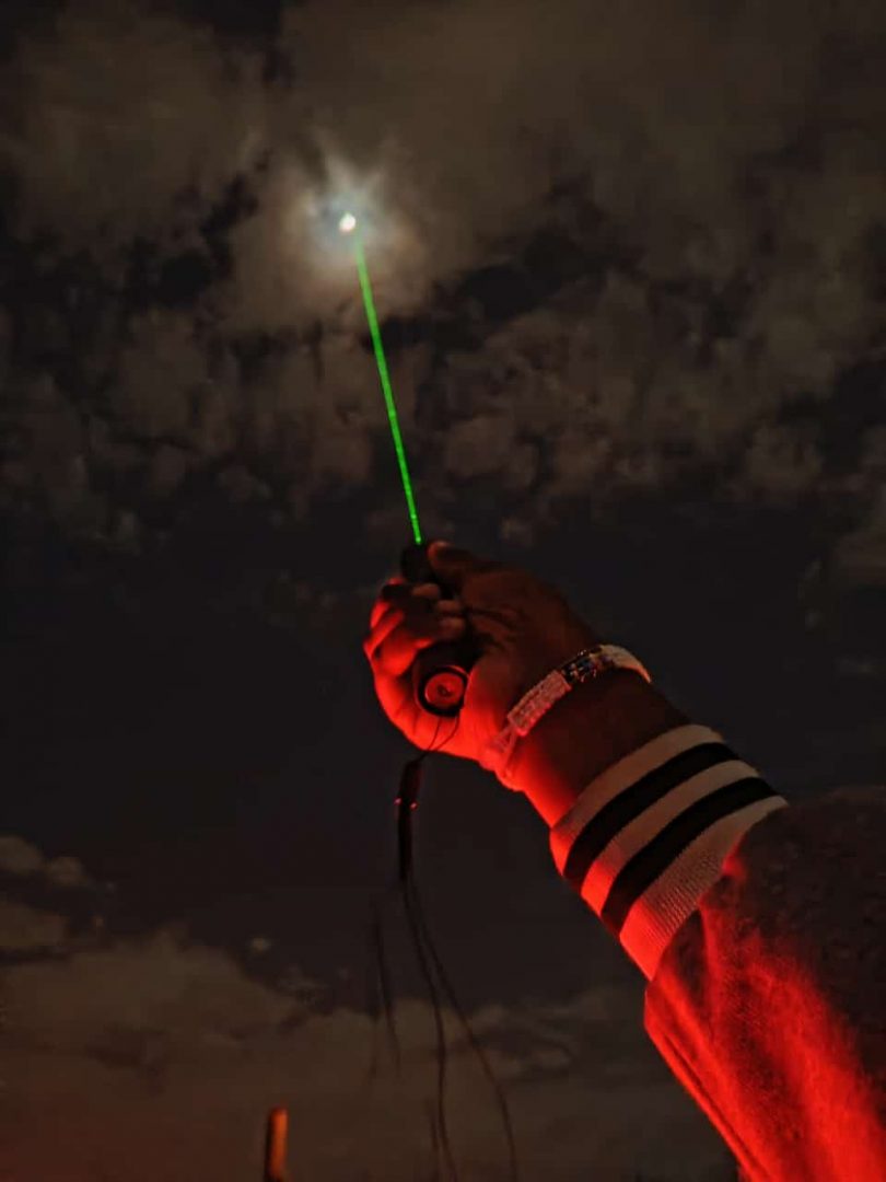 Shooting at the Moon with a laser.